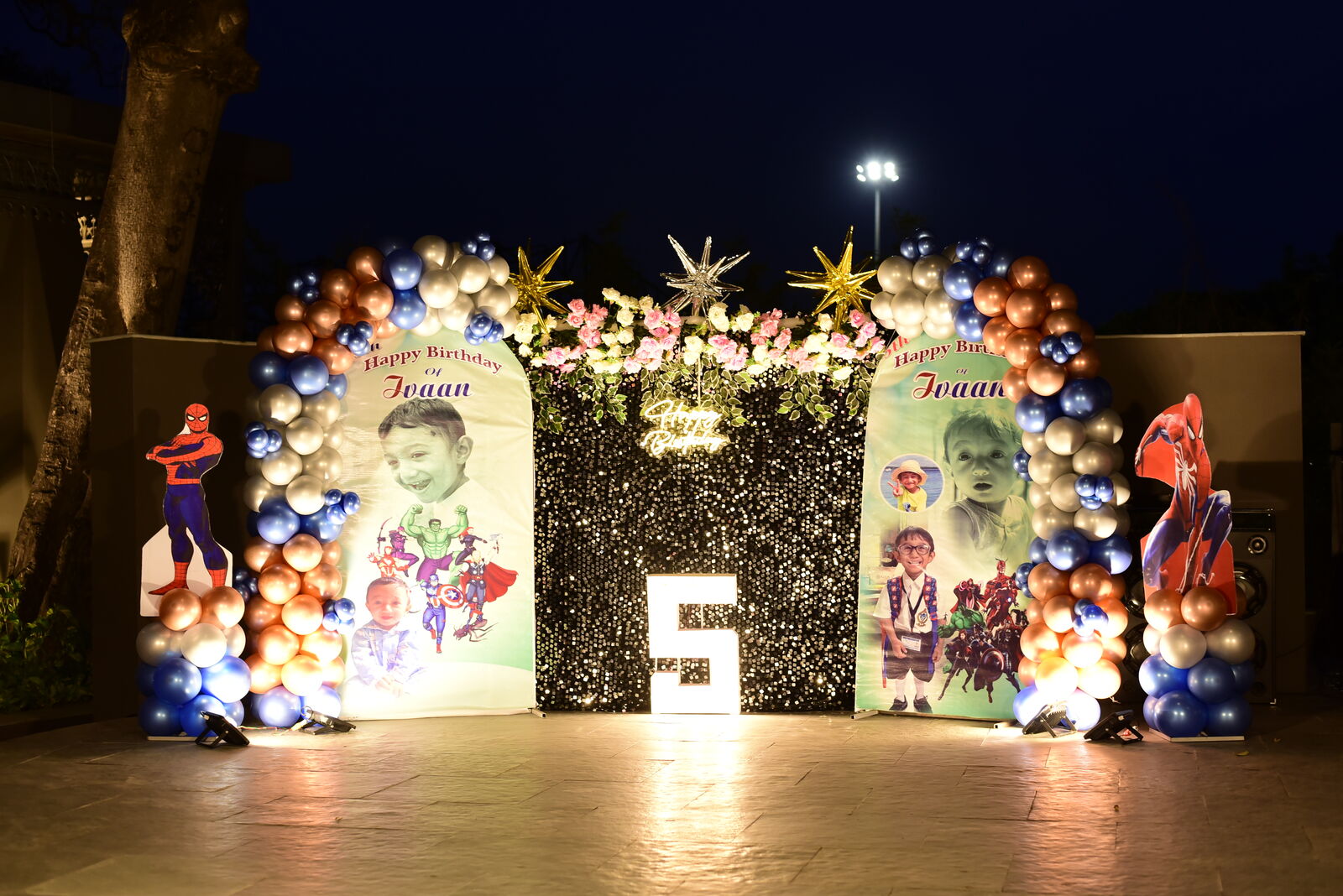 Illuminated balloon arch entrance at the outdoor evening activation