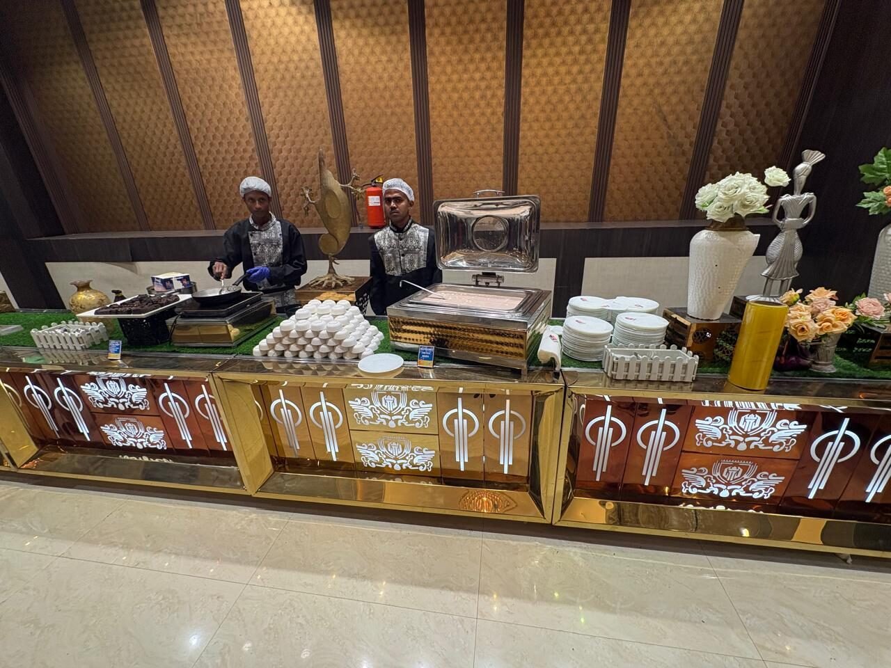 Live buffet counters with chefs serving guests