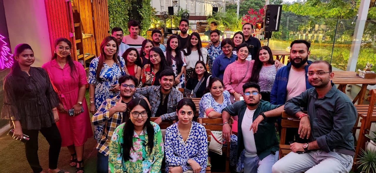 A full house of guests gathered on the lounge terrace at golden hour